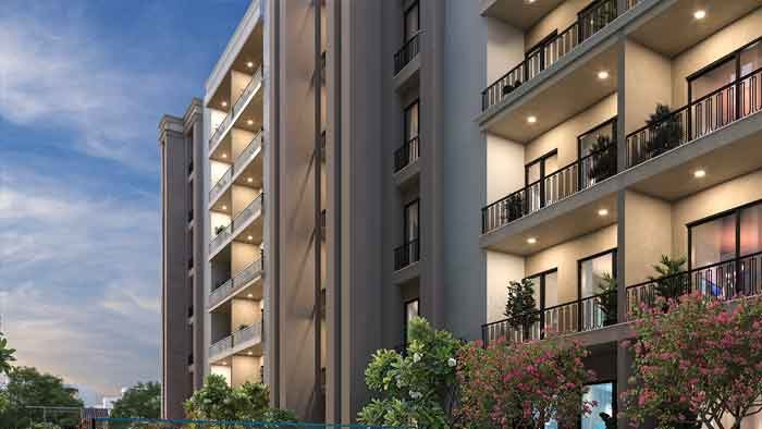 Evara Shades elevation at dusk with lit balconies
